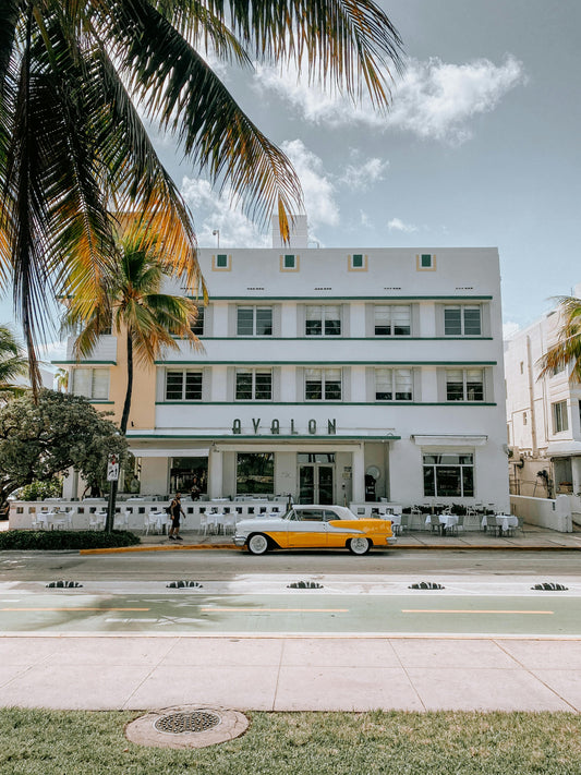 Yellow car in front of an art deco style house in Miami