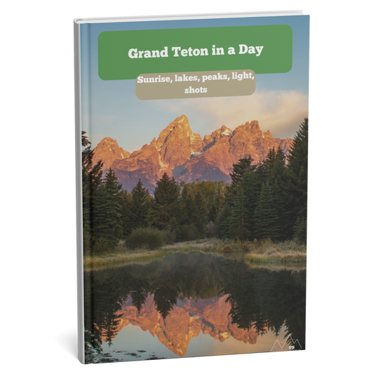 Book cover of 'Grand Teton in a Day' with mountain reflection in water and green banner.